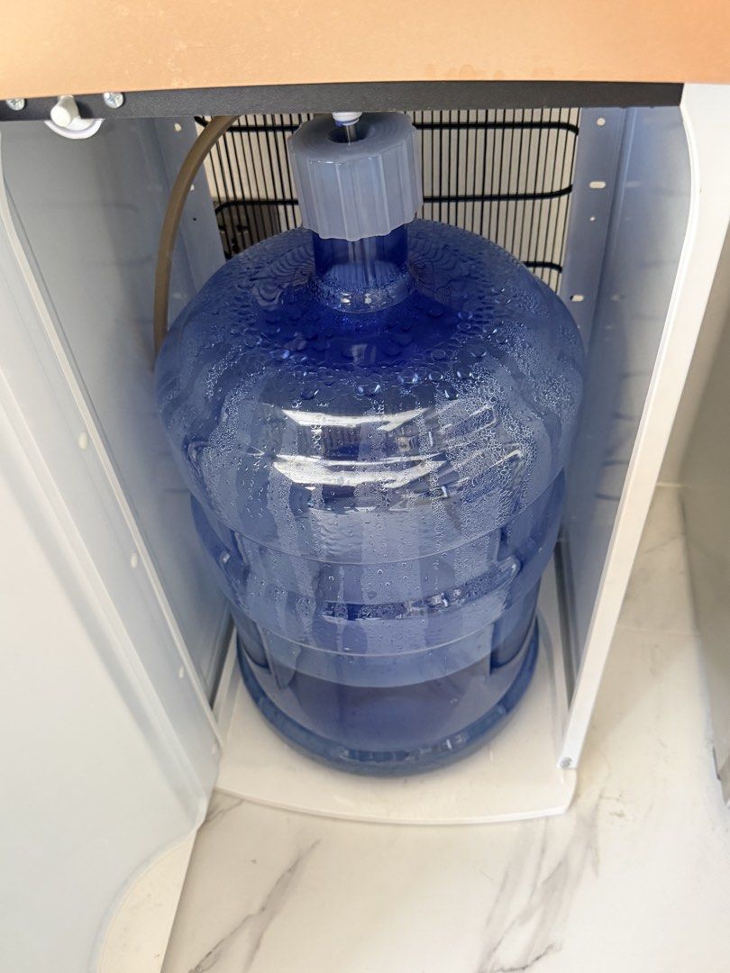 Asahi WD-108 Water Dispenser (Category: Water Purifiers & Dispensers) located in Naic. Submitted by nobletiger-d91e (Listing ID 1427645174, Image 3). Description: Asahi WD-108 water dispenser with hot, normal, and cold water options. Features a 5-year compressor warranty. The dispenser is white and rose gold in color. It has a top-loading design for water bottles. The model number is WD-108, and it operates on 230V/50 Hz. It has an on/off switch 