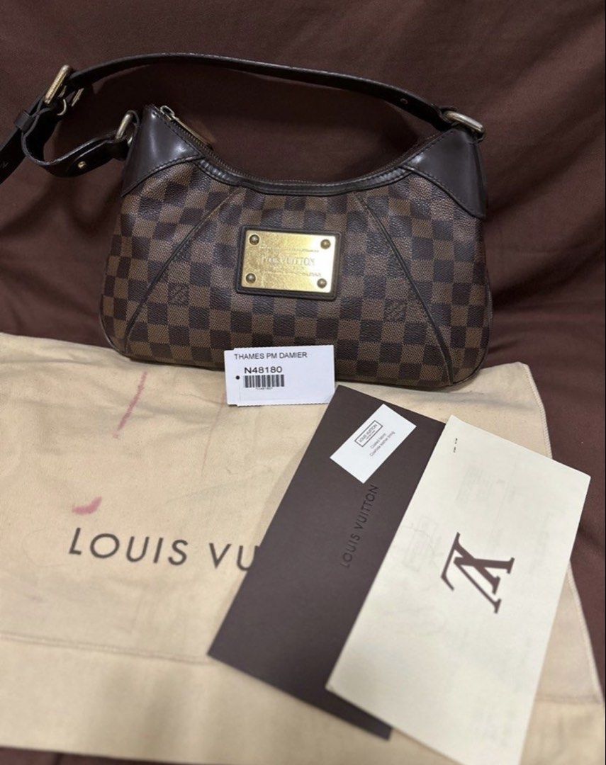 Authentic LV Thames PM (Category: Luxury Bags & Wallets) located in Cavite. Submitted by trendydotnet (Listing ID 1427698144, Image 1). Description: READ BELOW! SWIPE➡️ PHOTO DETAILS 🔍ITEM GUARANTEED 💯% AUTHENTIC Authėntic LV Thames PM - Inclusions: DustBag, Tag and Official Receipt from LV store - Hairlines on gold hardware - Rubs at the corners - Damaged fabric next to the zipper - See pic for bag condition - Not for fussy buyer **C0lor may v