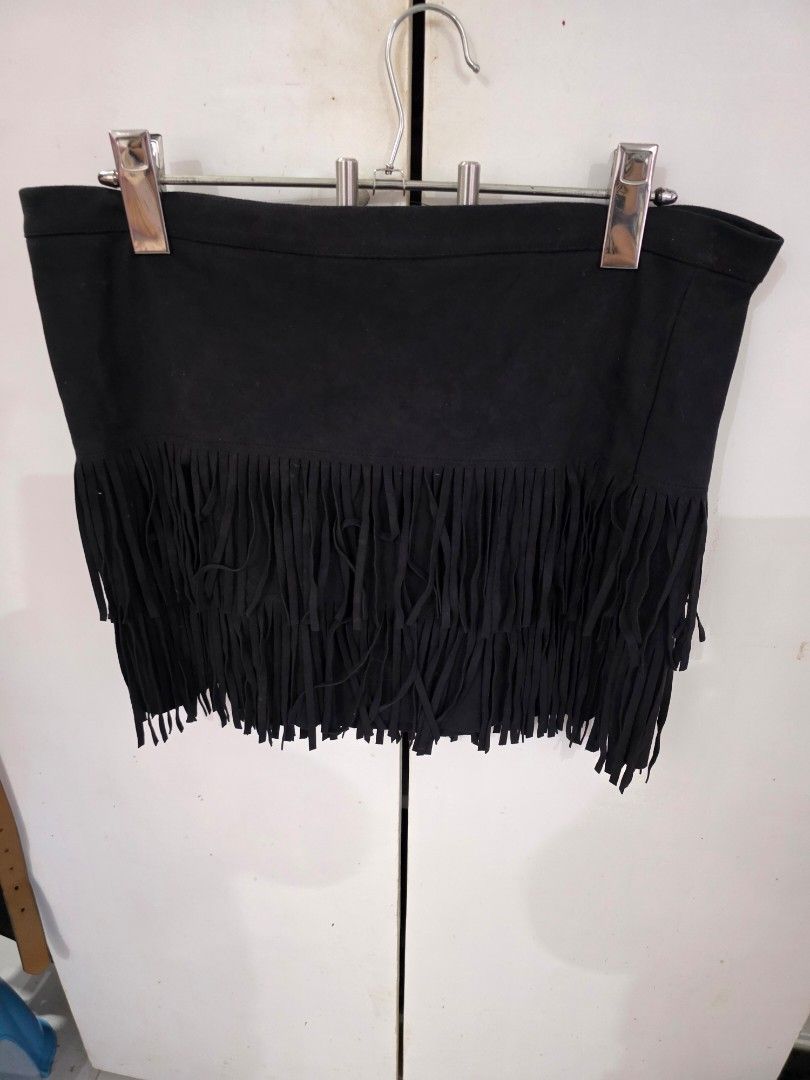 Black Fringe Skirt (Category: Skirts) located in Puerto Princesa. Submitted by kholene (Listing ID 1427738001, Image 1). Description: Black skirt with fringe detailing. The fringe is along the bottom edge. The skirt is hanging on a hanger..