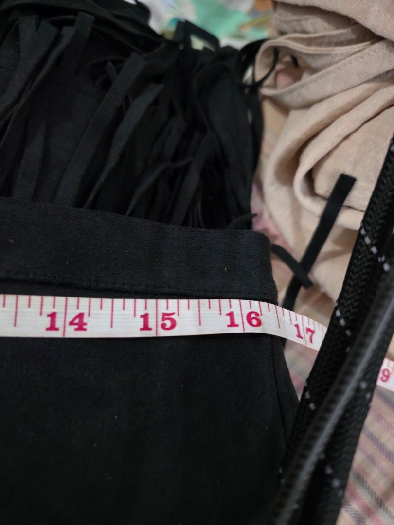 Black Fringe Skirt (Category: Skirts) located in Puerto Princesa. Submitted by kholene (Listing ID 1427738001, Image 2). Description: Black skirt with fringe detailing. The fringe is along the bottom edge. The skirt is hanging on a hanger..