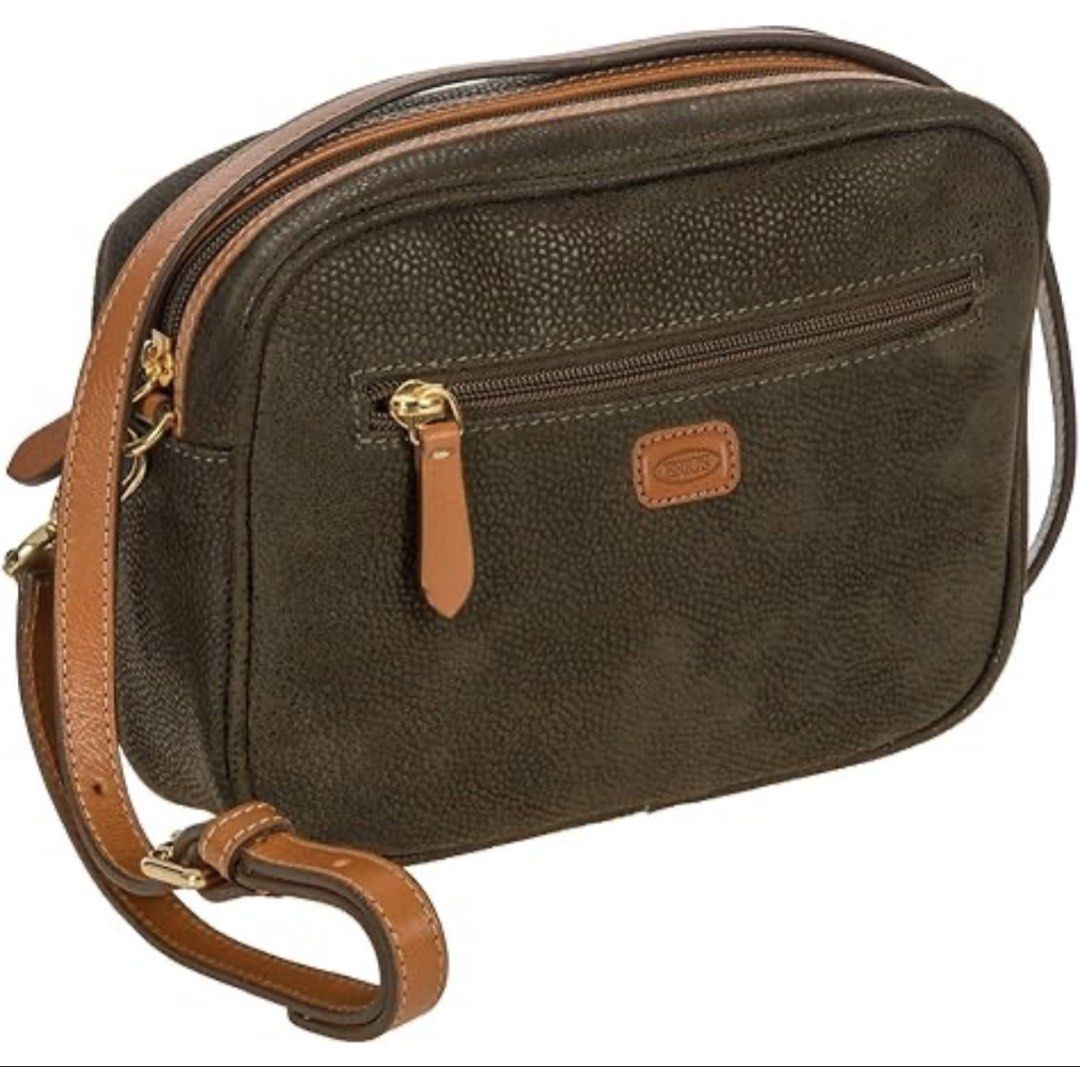 Bric's Crossbody Bag with Adjustable Strap (Category: Cross-body Bags) located in Manila. Submitted by goldenphoenix_ac6904 (Listing ID 1427715046, Image 1). Description: Bric's crossbody bag features a textured dark green exterior with tan leather accents. It has a zippered main compartment and a smaller zippered pocket on the front. The bag includes an adjustable shoulder strap .The interior is lined with a matching dark green fabric. The bag h