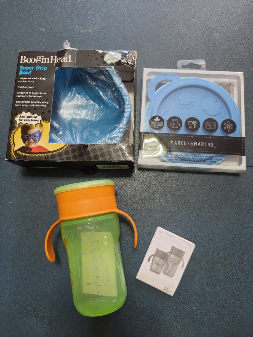 BUNDLE - BooginHead, Marcus & Marcus Baby Feeding Set & AVENT Sippy Cup (Category: Weaning & Toddler Feeding) located in Manila. Submitted by anneesp (Listing ID 1427762210, Image 1). Description: Set includes a BooginHead Super Grip Bowl, a Marcus & Marcus silicone bowl with lid, and a baby sippy cup. The BooginHead bowl has a unique suction base. The Marcus & Marcus bowl is made of silicone and has a lid. The sippy cup has handles and a lid. Al