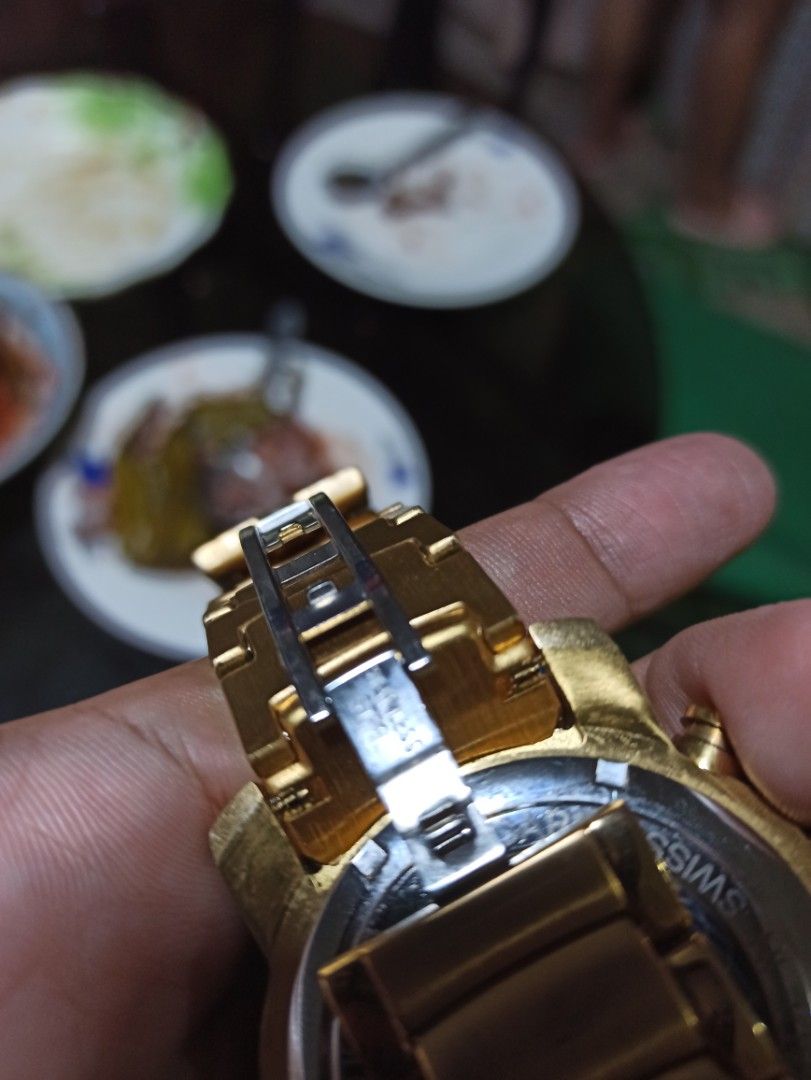 Bvlgari Watch (Category: Luxury Watches) located in Tagbilaran City. Submitted by delasierra39181 (Listing ID 1427734755, Image 3). Description: Gold-toned Bvlgari watch with a skeleton dial. Features a tachymeter and chronograph functions. The watch has a gold bracelet strap and a clasp closure. The back of the watch indicates it is made in Switzerland and is numbered out of 1000. The watch has a unique design with visible internal mechanisms..