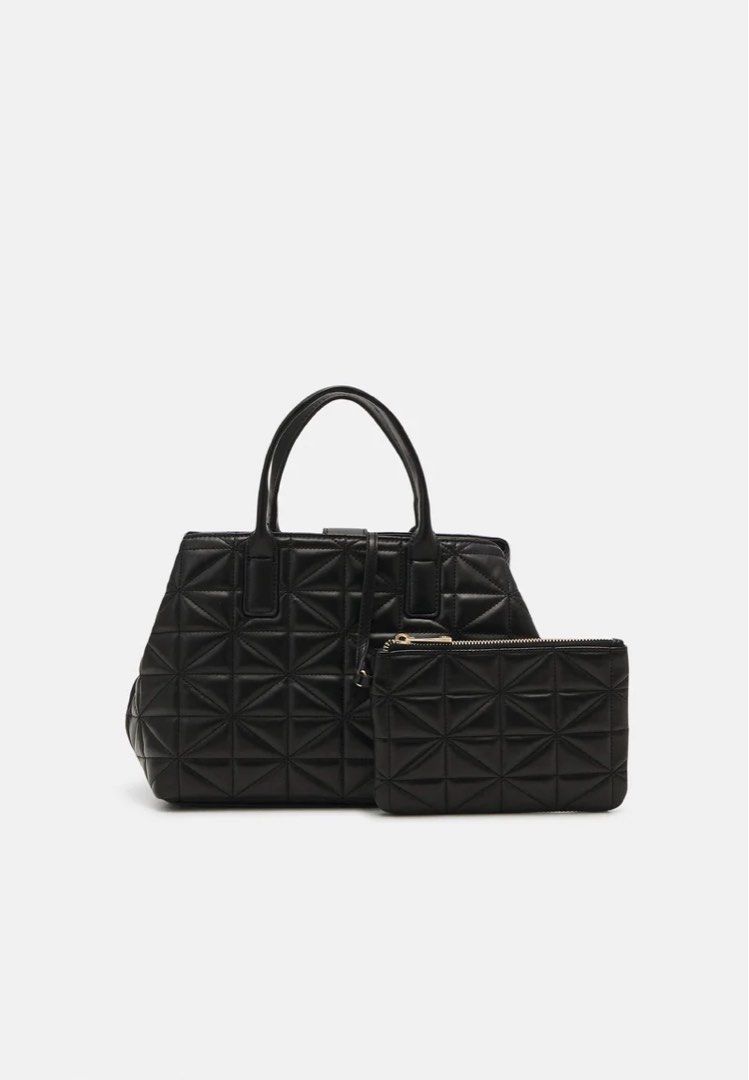 Call It Spring QUINNY Quilted Satchel Bag (Category: Luxury Bags & Wallets) located in Pasig City. Submitted by eiannn (Listing ID 1427748372, Image 3). Description: QUINNY Quilted Satchel Bag Color: Black Brand Name: Call It Spring Bag Dimension: 28 L X 15 W X 22 H Cm Material: Synthetic Type: Satchel Bag Size: Medium Fastener: Zip Fashion Segment: Premium Spacious and stylish, perfect for carrying all your daily essentials with ease, featuring 