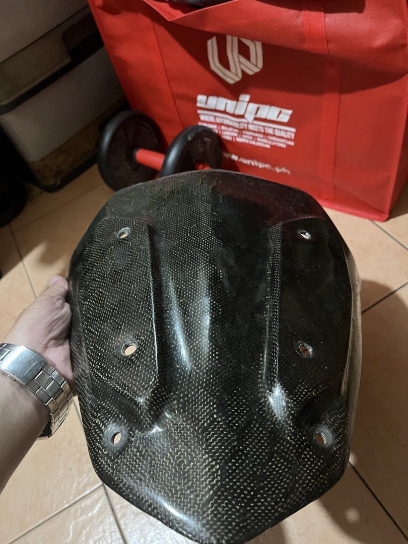 Carbon Nmax V2 Visor (Category: Helmets and other Riding Gears) located in Manila. Submitted by roimatthewww (Listing ID 1427746270, Image 3). Description: FOR NMAX V2 See pics for issues - Carbon fiber motorcycle fairing - Front fairing design - Multiple mounting holes - Textured carbon fiber weave - Minor crack on the edge.