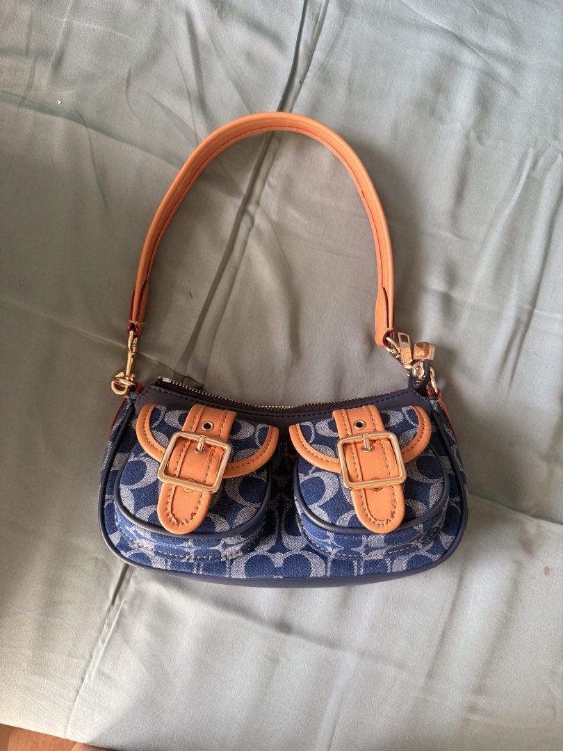 Coach Denim Shoulder Bag (Category: Luxury Bags & Wallets) located in Cainta. Submitted by kitskit (Listing ID 1427684605, Image 1). Description: - msg me for more deets - made in Vietnam.