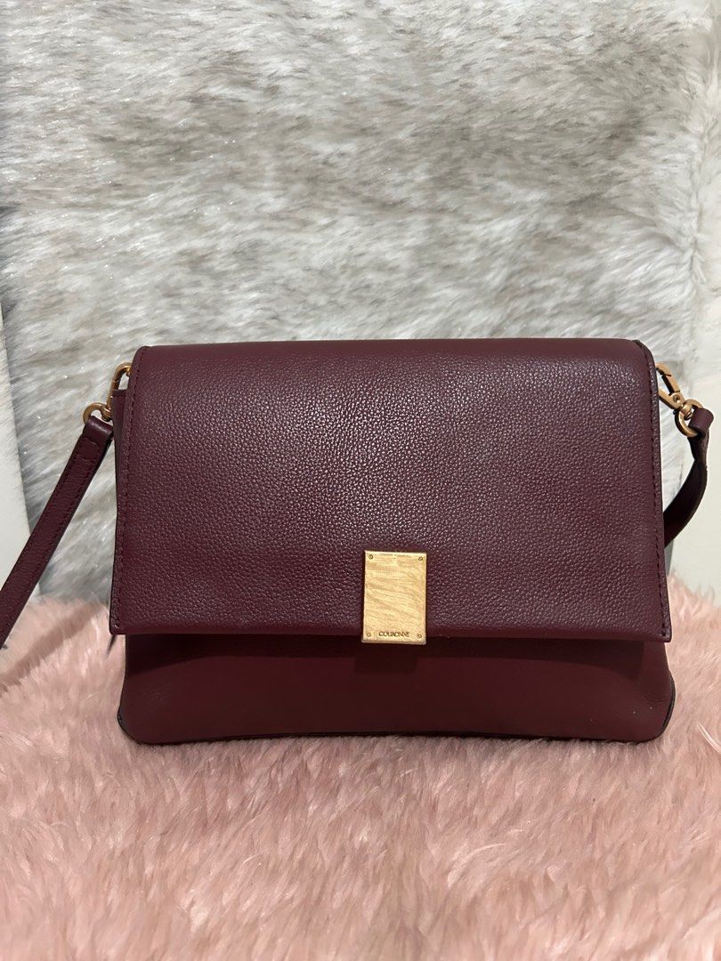 Couronne Sling bag (Category: Luxury Bags & Wallets) located in Quezon City. Submitted by heycathiee (Listing ID 1427659744, Image 2). Description: Couronne sling bag ~ rank 8/10 ~ maroon / burgundy color ~ comes w adjustable sling ~ no rubs; normal signs of used only ~ metal plate w hairlines ~ with inner pocket In cm : L 25 | H 18 | W 7.5 .