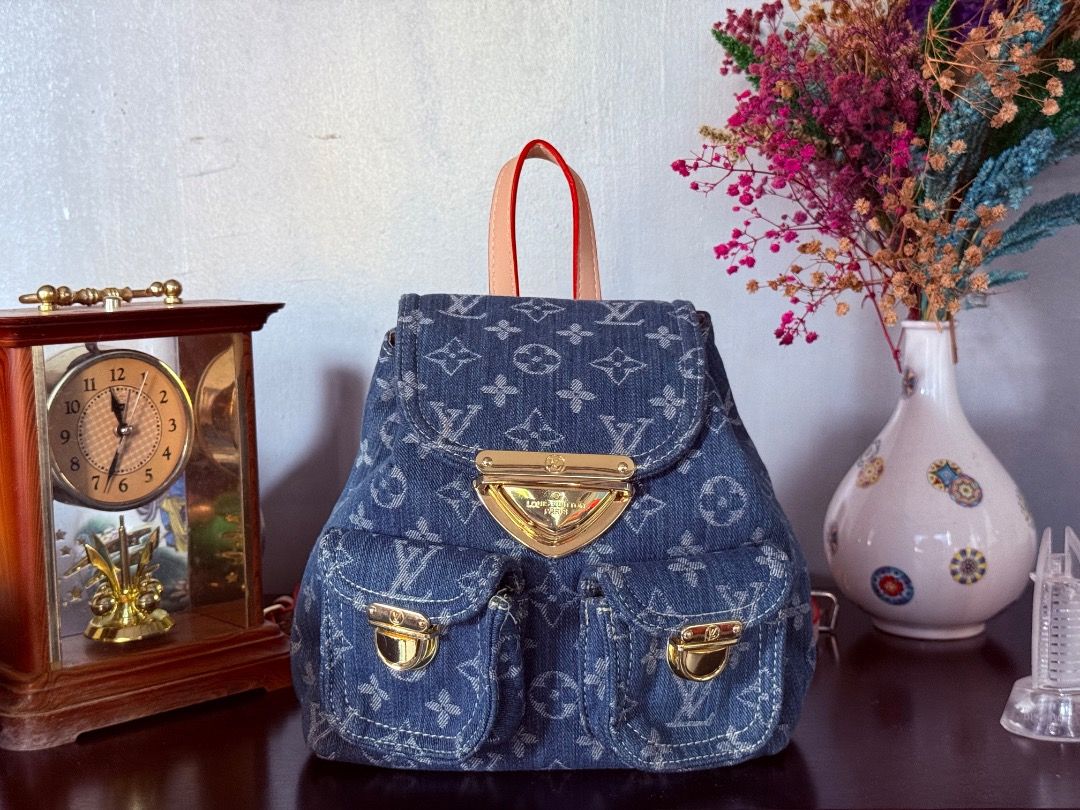 Cute Mini Denim Bag (Category: Luxury Bags & Wallets) located in Cotabato. Submitted by goldenhiveph0826 (Listing ID 1427712757, Image 3). Description: ❤️○ Stylish denim backpack with LV monogram pattern ❤️○ Gold hardware, pink leather handles/straps, red trim ❤️○ Spacious interior, like-new condition with minimal signs of use ❤️• Features: Two front pockets, flap closure, adjustable straps. ✅• Perfect for: School, work, or weekend trips ✅• Dimen
