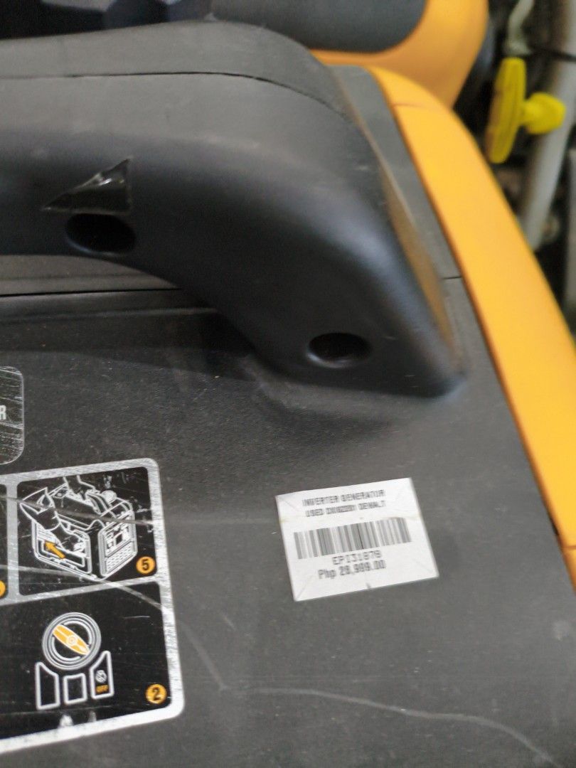 DeWALT DXIE201 Inverter Generator (Category: Construction Tools & Equipment) located in Manila. Submitted by hmrgrace5. (Listing ID 1427642656, Image 3). Description: DeWALT DXIE201 Inverter Generator. Features a black and yellow design with a handle for easy transport. Includes a fuel cap and various operational indicators. The unit has a control panel with start and stop functions. It also has a warning label regarding fuel usage..