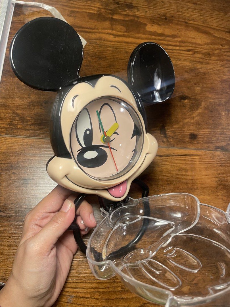 Disney Mickey Mouse Clock (Category: Clocks) located in Quezon City. Submitted by mixeditemsforsale (Listing ID 1427765161, Image 2). Description: Mickey Mouse-shaped clock. It features Mickey's face as the clock face, with his ears on top. The clock has a clear plastic base. It's a fun and collectible item for Disney fans..