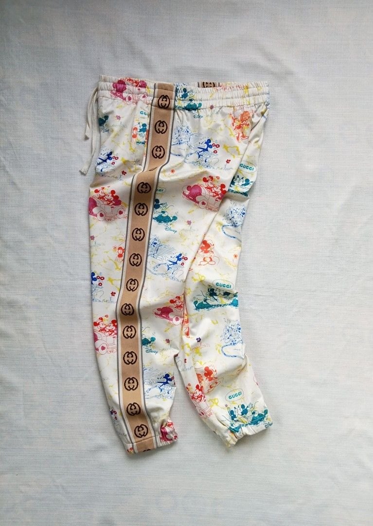 Disney x Gucci sidetape jogger pants (Category: Luxury Apparel) located in Bagabag. Submitted by thrift_stories96 (Listing ID 1427745148, Image 3). Description: Disney x Gucci sidetape jogger pants Small to medium frame Waistline - 28 to 32 Length - 35 Condition - excellent Flaw - missing washtag.