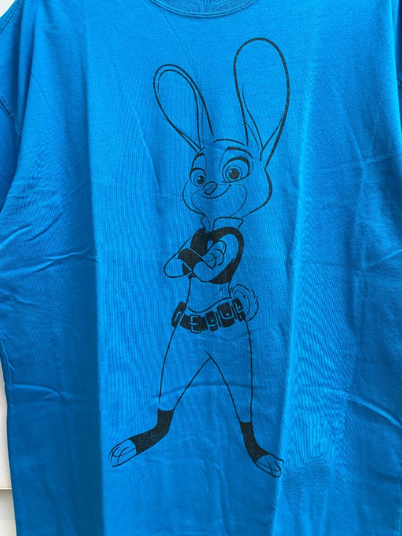 Disney Zootopia Judy Hopps Graphic Tee (Category: Tshirts & Polo Shirts ) located in Pasig City. Submitted by greatestpickup (Listing ID 1427673456, Image 2). Description: Blue t-shirt features a graphic of Judy Hopps from Zootopia. The design is printed on the front of the shirt. The shirt is a vibrant blue color. disney judy hopps xl on tag 23x29 350.