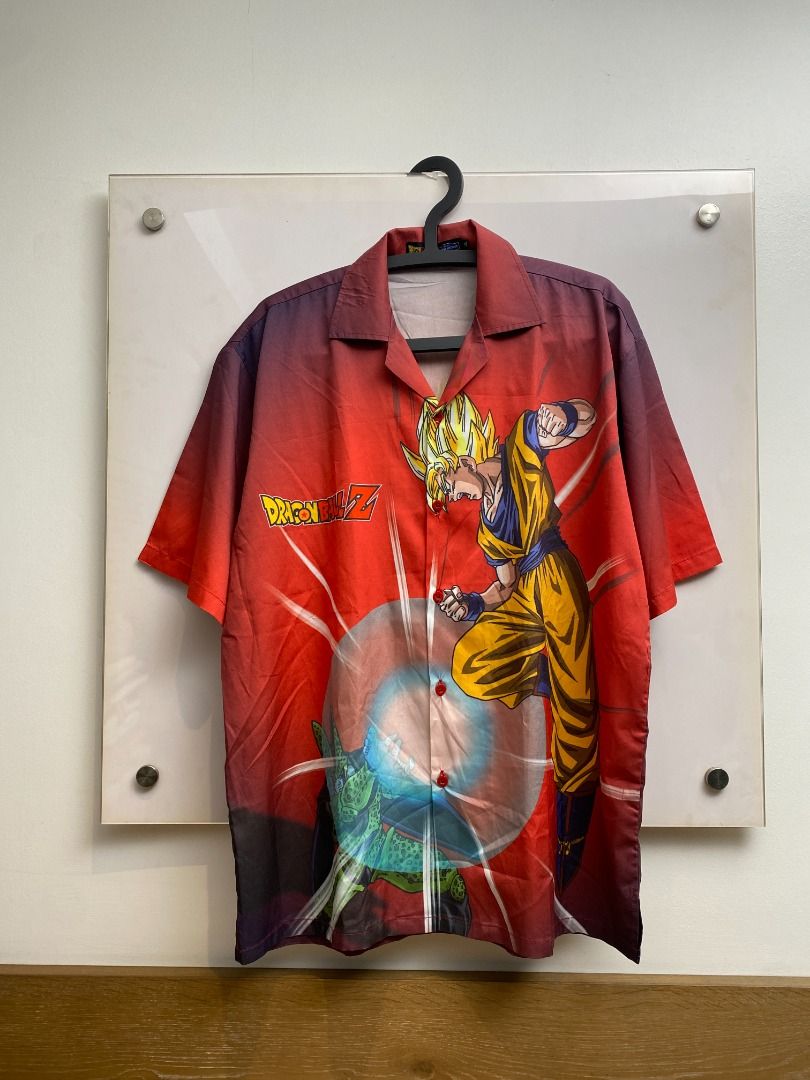 Dragon Ball Z Button-Up Shirt (Category: Tshirts & Polo Shirts ) located in Pasig City. Submitted by greatestpickup (Listing ID 1427689669, Image 1). Description: Button-up shirt features Dragon Ball Z characters Goku and Cell on the front, and Gohan and Cell on the back. The shirt has a red base color with a gradient effect. It has short sleeves and a collared neckline. The shirt has a button-up closure. dbz aop polo xl on tag 24x30 1500 .