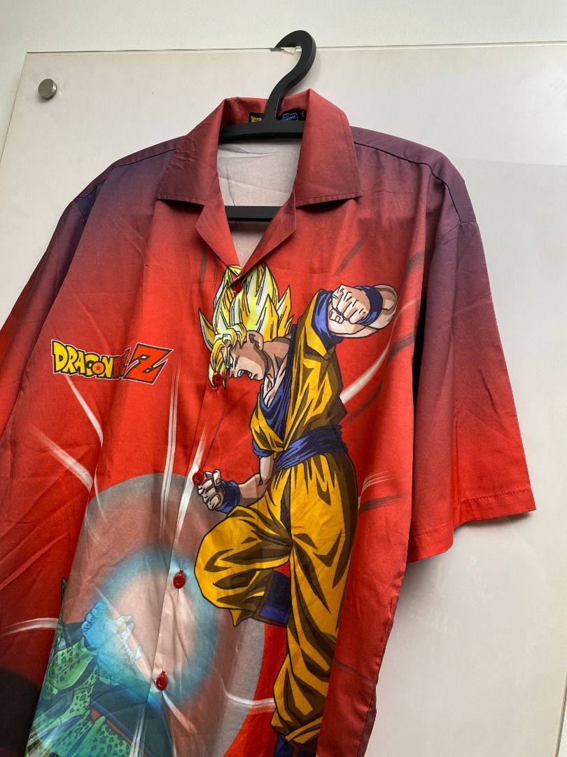 Dragon Ball Z Button-Up Shirt (Category: Tshirts & Polo Shirts ) located in Pasig City. Submitted by greatestpickup (Listing ID 1427689669, Image 3). Description: Button-up shirt features Dragon Ball Z characters Goku and Cell on the front, and Gohan and Cell on the back. The shirt has a red base color with a gradient effect. It has short sleeves and a collared neckline. The shirt has a button-up closure. dbz aop polo xl on tag 24x30 1500 .