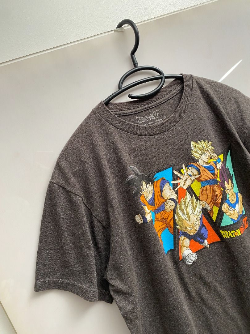 Dragon Ball Z Graphic Tee (Category: Tshirts & Polo Shirts ) located in Pasig City. Submitted by greatestpickup (Listing ID 1427683381, Image 3). Description: Dragon Ball Z t-shirt features a graphic print of Goku, Vegeta, and other characters. It has a crew neck and short sleeves. The shirt is a dark grey color. dbz goku vegetta shapes xl on tag 20x26 500 .