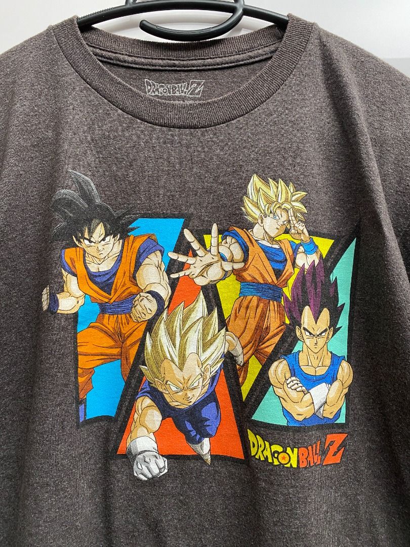 Dragon Ball Z Graphic Tee (Category: Tshirts & Polo Shirts ) located in Pasig City. Submitted by greatestpickup (Listing ID 1427683381, Image 2). Description: Dragon Ball Z t-shirt features a graphic print of Goku, Vegeta, and other characters. It has a crew neck and short sleeves. The shirt is a dark grey color. dbz goku vegetta shapes xl on tag 20x26 500 .