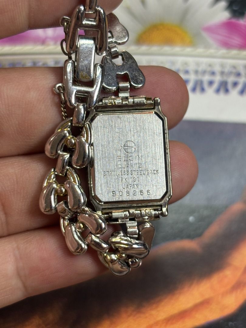 ELGIN RECTANGULAR GOLD – VINTAGE DRESS WATCH (Category: Women's Watches) located in Mandaue City. Submitted by nippon-finds (Listing ID 1427715605, Image 2). Description: Brand/Model: Elgin Quartz Case Size: approx. 20mm Year: 1990s Material: Gold Plated (GP) Details: Rectangular case, gold dial, jewelry-style bracelet Condition: Good, light wear Price: ₱2,000 Meet-up: IT Park Cebu (weekdays), SM JMall Mandaue (weekends) Shipping: Available, ship