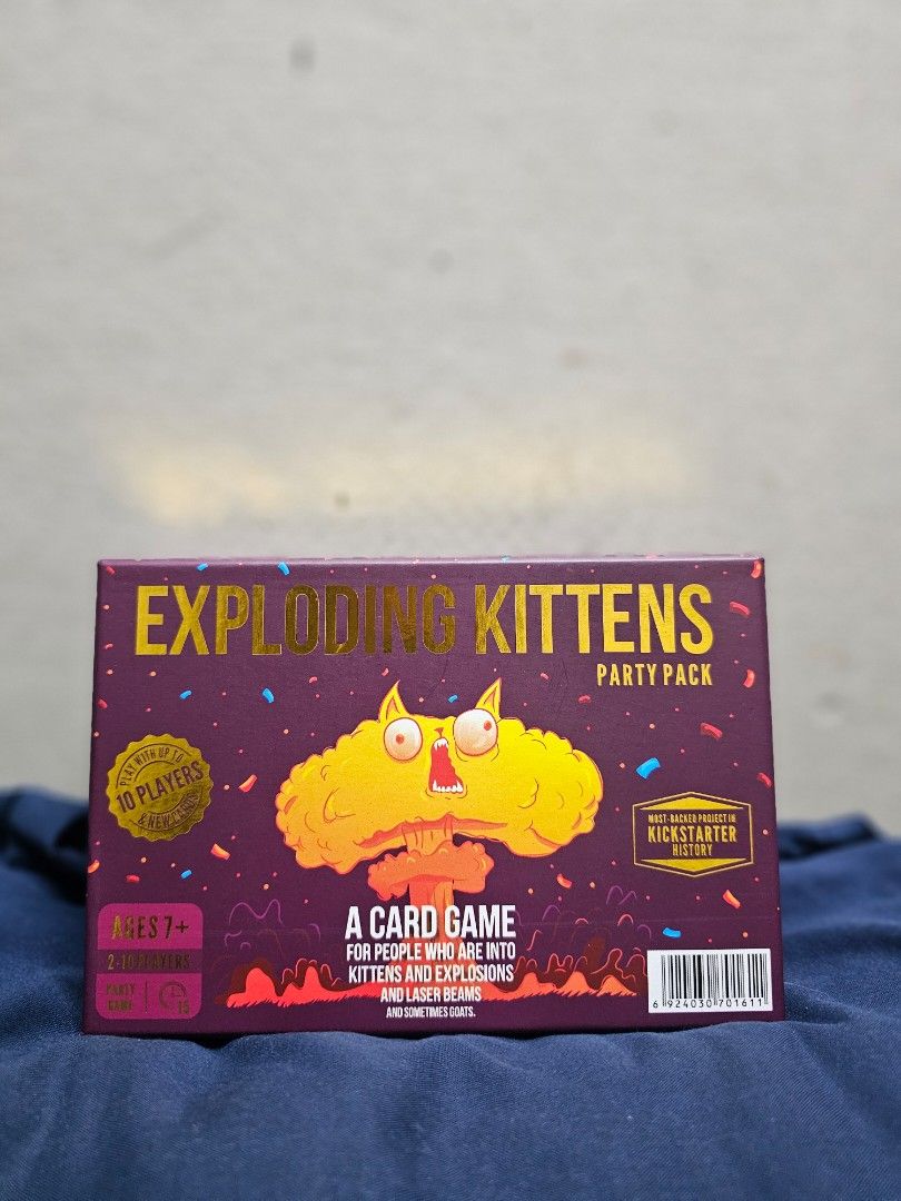 Exploding Kittens Party Pack Card Game (Category: Board Games & Puzzles) located in Manila. Submitted by shopwithella.ph (Listing ID 1427660462, Image 1). Description: 💯 EXPLODING KITTENS CARD GAME PARTY VERSION BRAND NEW HIGH QUALITY CARDS 💯 🌟 Please see attached photos for your entertainment 🌟 🌟 Those photos are the actual photos inside. I photographed them on my own. Please do not use for your shop, thank you very much 🌟 🌟 Not branded, 