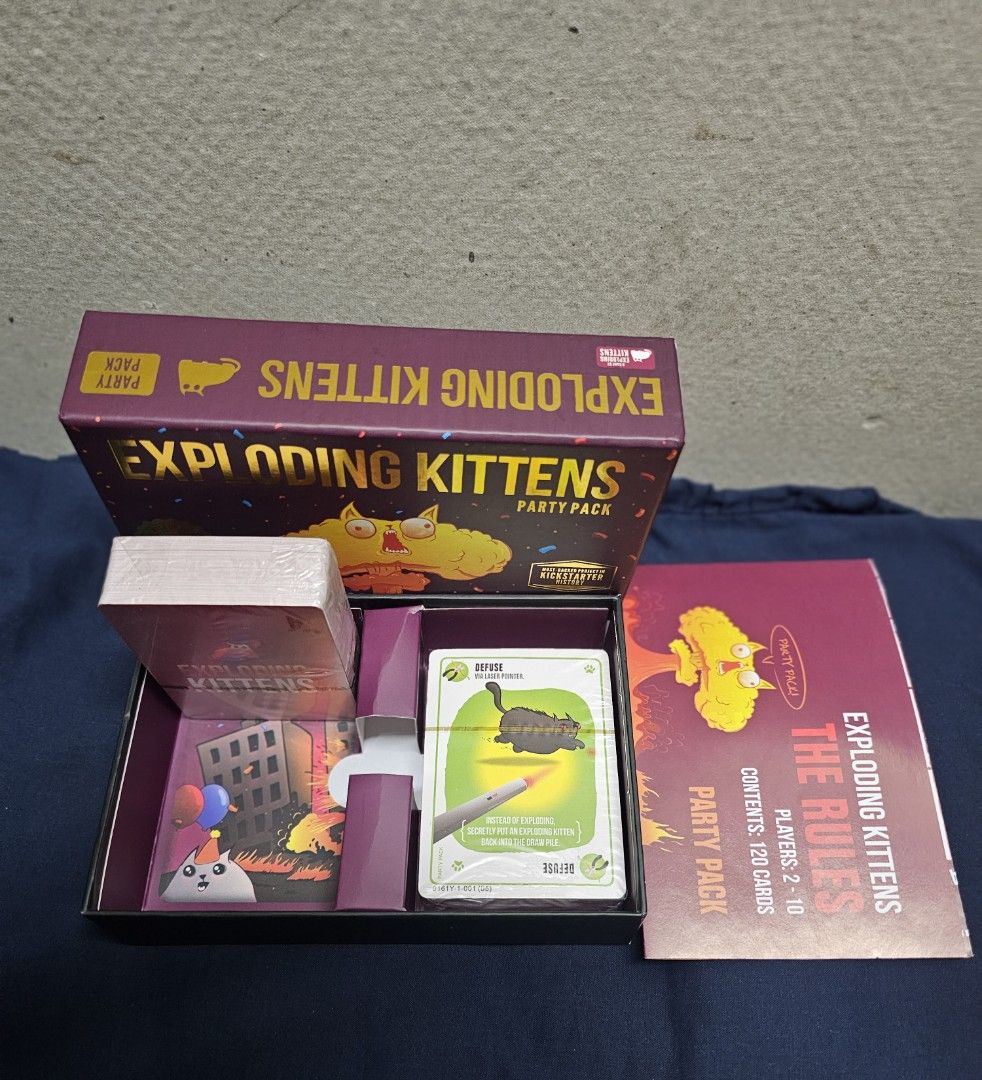 Exploding Kittens Party Pack Card Game (Category: Board Games & Puzzles) located in Manila. Submitted by shopwithella.ph (Listing ID 1427660462, Image 3). Description: 💯 EXPLODING KITTENS CARD GAME PARTY VERSION BRAND NEW HIGH QUALITY CARDS 💯 🌟 Please see attached photos for your entertainment 🌟 🌟 Those photos are the actual photos inside. I photographed them on my own. Please do not use for your shop, thank you very much 🌟 🌟 Not branded, 