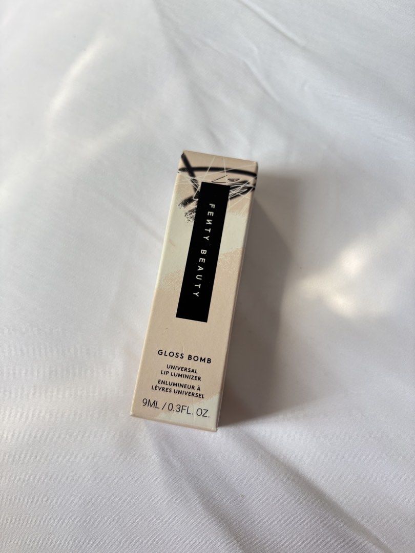 Fenty Beauty Gloss Bomb Universal Lip Luminizer (Category: Makeup) located in Navotas City. Submitted by hellolades (Listing ID 1413906447, Image 3). Description: SALE Two Fenty Beauty Gloss Bomb Universal Lip Luminizers in the shade Fussy 02. 5.5ml Php 1000 (free sf via j&t) 9ml Php 1499 (free sf via j&t).