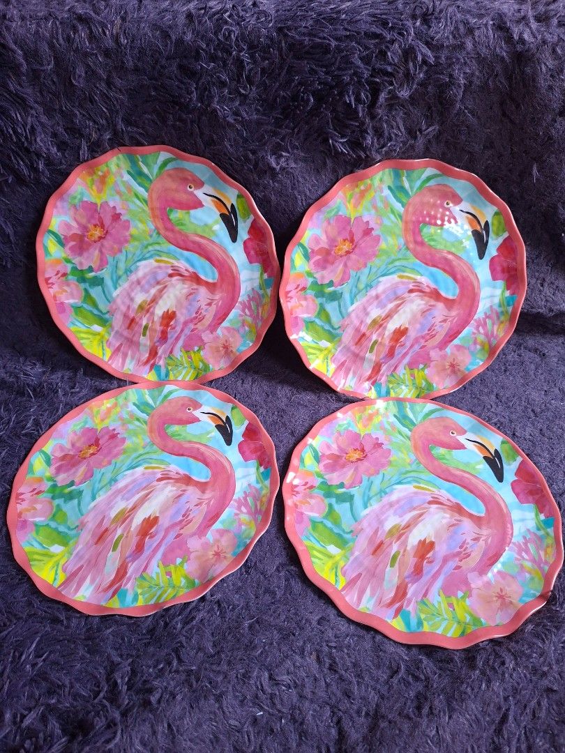Flamingo Design Plates Set of 4 (Category: Dinnerware & Cutlery) located in Quezon City. Submitted by charsonetrends (Listing ID 1427665939, Image 1). Description: Set of four decorative plates featuring a vibrant flamingo design. Each plate has a scalloped edge and a colorful flamingo and floral pattern. The plates are suitable for dishwasher and safe-top rack use. .