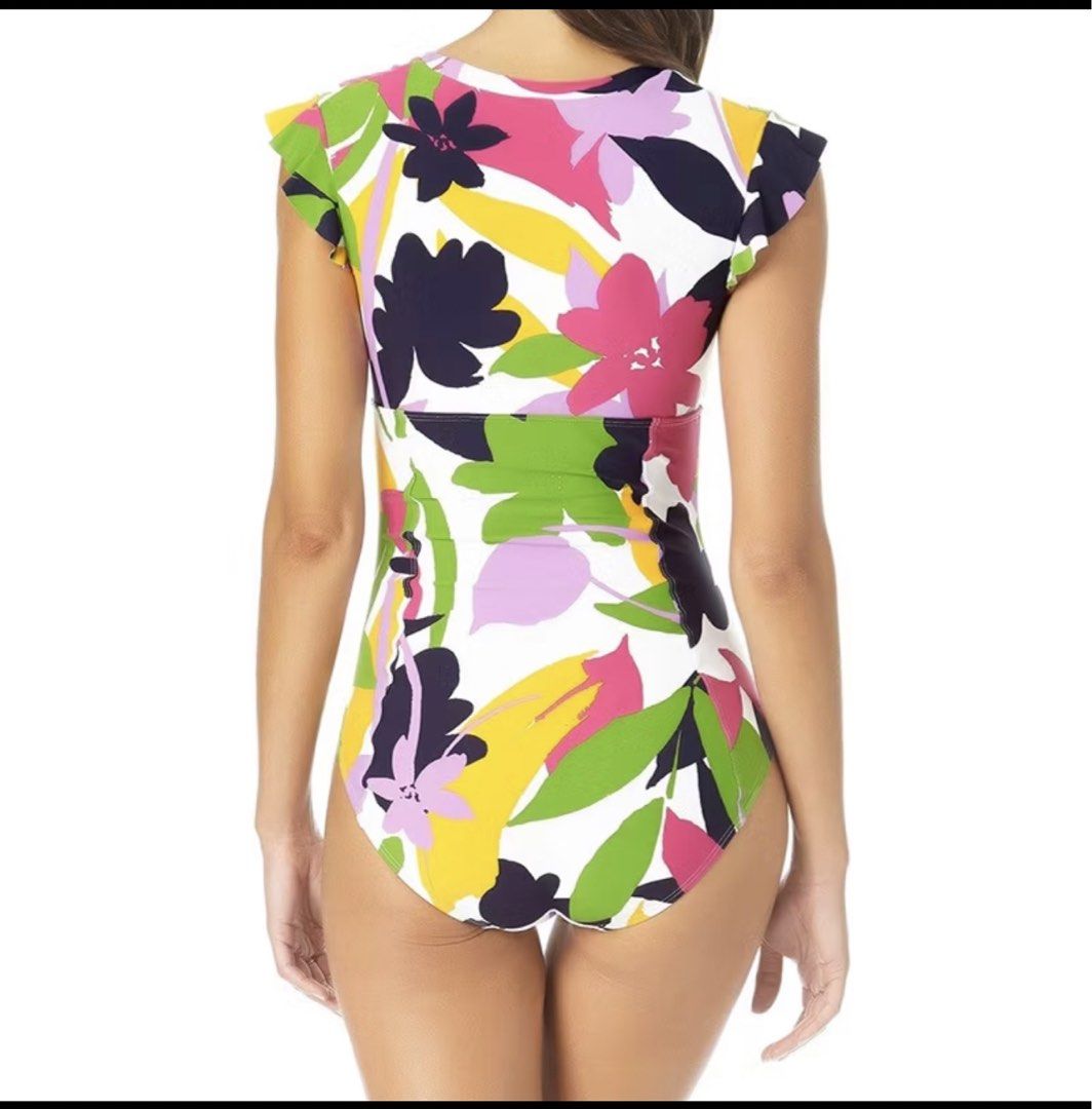 Floral Print One-Piece Swimsuit (Category: Bikinis & Swimsuits) located in Cavite. Submitted by beeminees (Listing ID 1427775528, Image 2). Description: -One-piece swimsuit features a vibrant floral print with a zip-up front and ruffled sleeves. - It has a flattering ruched detail at the waist. -Brand new -Reason for selling: too big for my frame .