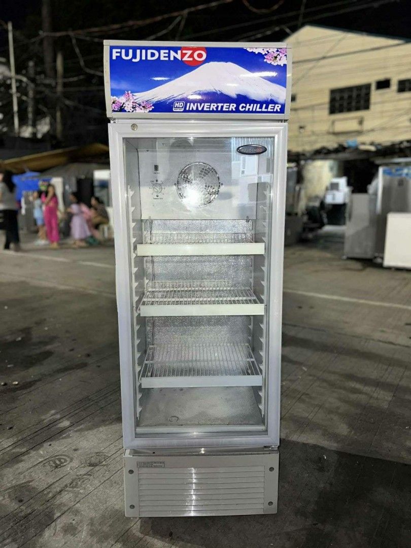Fujidenzo Inverter Chiller (Category: Refrigerators and Freezers) located in Pasig City. Submitted by alasoreymo35490 (Listing ID 1427779363, Image 2). Description: Fujidenzo Inverter Chiller with multiple shelves. It has a glass door and a fan inside. The chiller is tall and has a silver finish. The Fujidenzo logo is visible at the top. It is suitable for commercial use..