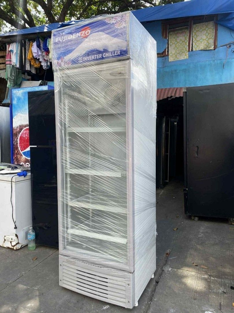 Fujidenzo Inverter Chiller (Category: Refrigerators and Freezers) located in Pasig City. Submitted by alasoreymo35490 (Listing ID 1427779363, Image 3). Description: Fujidenzo Inverter Chiller with multiple shelves. It has a glass door and a fan inside. The chiller is tall and has a silver finish. The Fujidenzo logo is visible at the top. It is suitable for commercial use..