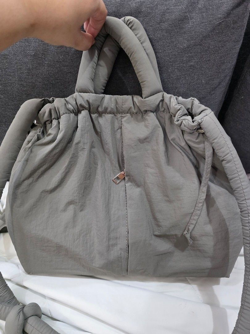 Grey Drawstring Tote Bag (Category: Tote Bags) located in Manila. Submitted by catheringcake (Listing ID 1427774470, Image 1). Description: -GU inspired sling bag, bought in taiwan - price is negotiable.
