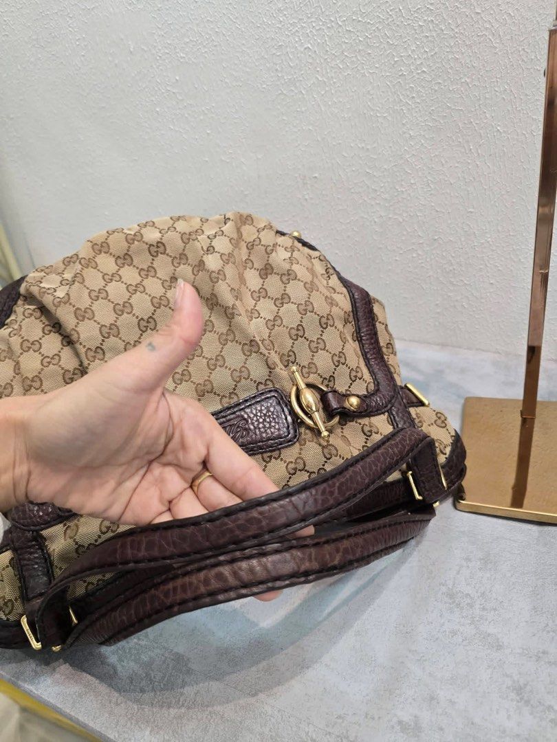 Gucci Sukey Handbag (Category: Luxury Bags & Wallets) located in Davao. Submitted by jackie2276 (Listing ID 1427744221, Image 3). Description: Authentic Gucci Sukey handbag. Features the iconic GG canvas with brown leather trim and handles. Includes a dust bag. The interior has a Gucci label with "made in Italy" and serial number 203546 001013. The bag has a spacious interior and a classic design, perfect for everyday use..