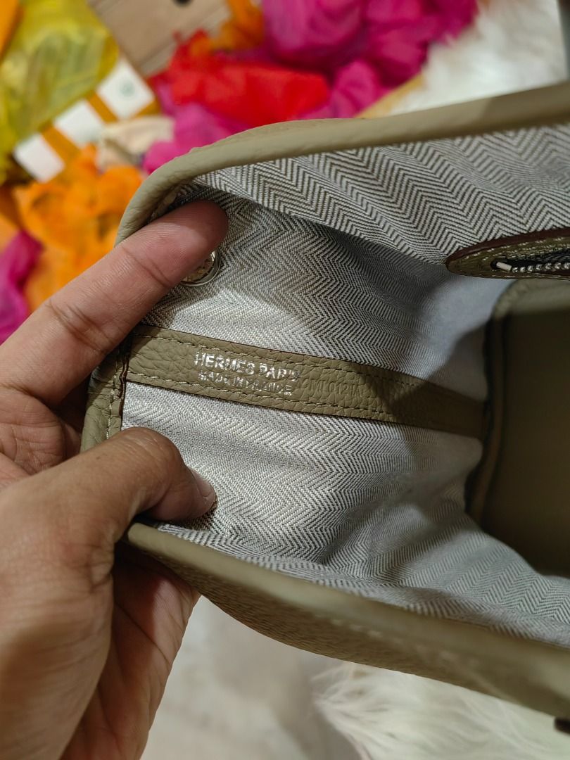 Hermes Garden Party Tote Bag (Category: Luxury Bags & Wallets) located in Cebu City. Submitted by erlacoleccion (Listing ID 1427643164, Image 2). Description: Beige Hermes Garden Party tote bag. It features a structured design with a top handle. It comes with a dust bag. The interior lining is visible, and the bag has a simple, elegant design..