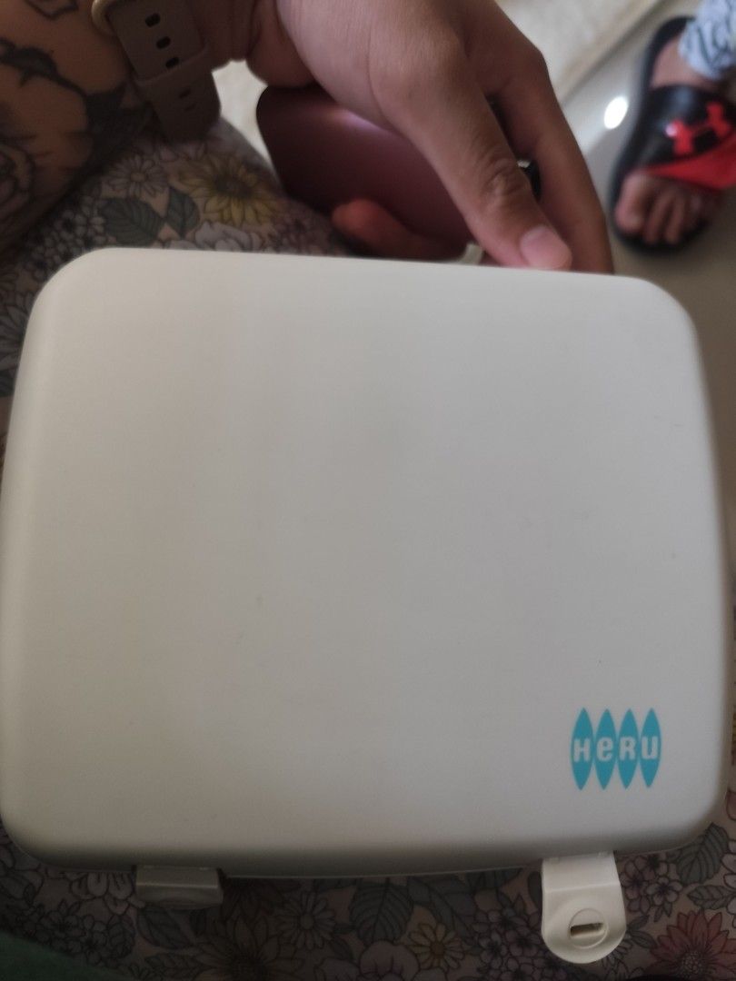 Heru Electric Manicure/Pedicure Set PM 112 (Category: Hands & Nails) located in Cavite. Submitted by mavi.gif (Listing ID 1427675122, Image 1). Description: Heru Electric Manicure/Pedicure Set PM 112. Includes the main device, various attachments for nail care, a power adapter, and a storage case. The device has a white and teal color scheme. - Imported from Germany - Working 100 %.