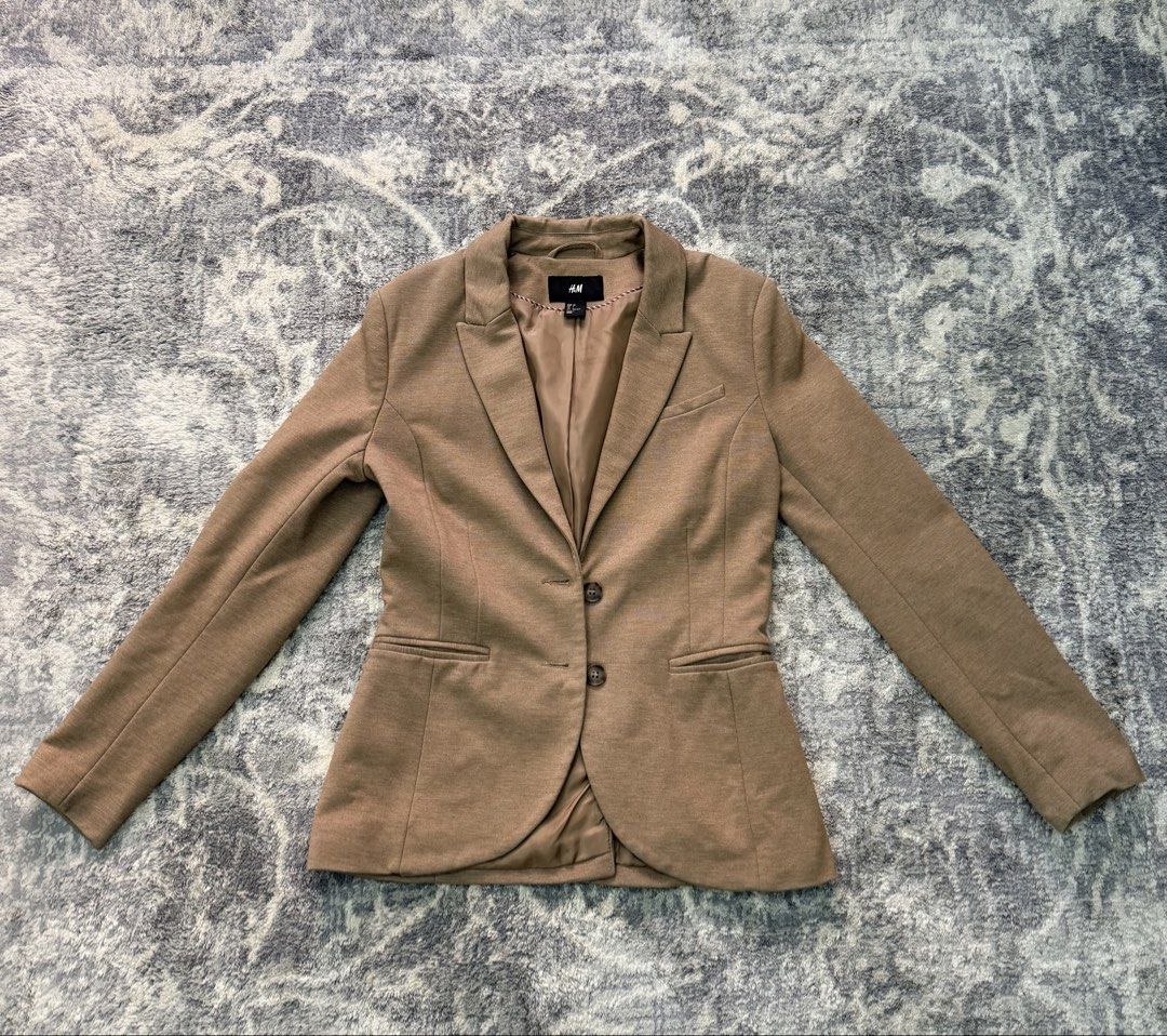 H&M Blazer - Tan (Category: Coats, Jackets and Outerwear) located in Pasay City. Submitted by netuy (Listing ID 1427699389, Image 1). Description: H&M tailored-fit blazer with lining. Color tan. Size 36 or small . With 3 pockets - 2 side pockets & 1 breast pocket. Extra buttons intact. .