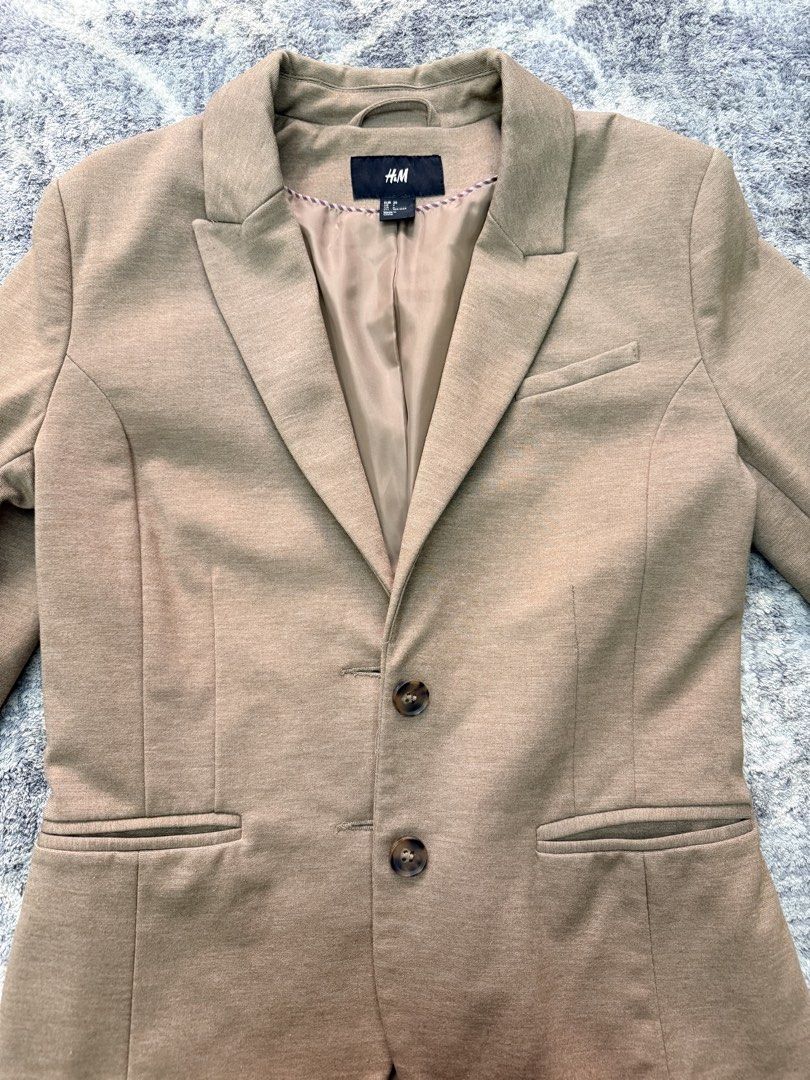 H&M Blazer - Tan (Category: Coats, Jackets and Outerwear) located in Pasay City. Submitted by netuy (Listing ID 1427699389, Image 3). Description: H&M tailored-fit blazer with lining. Color tan. Size 36 or small . With 3 pockets - 2 side pockets & 1 breast pocket. Extra buttons intact. .