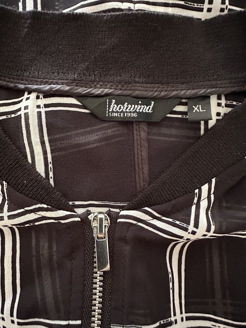 Hotwind Plaid Dress XL (Category: Dresses) located in Muntinlupa City. Submitted by belica (Listing ID 1427670841, Image 3). Description: Hey there! Check out this stylish Hotwind plaid dress in XL! It's a chic, longline jacket dress with a cool black and white plaid design. The material looks light and airy, perfect for layering. DM me if you're interested!.