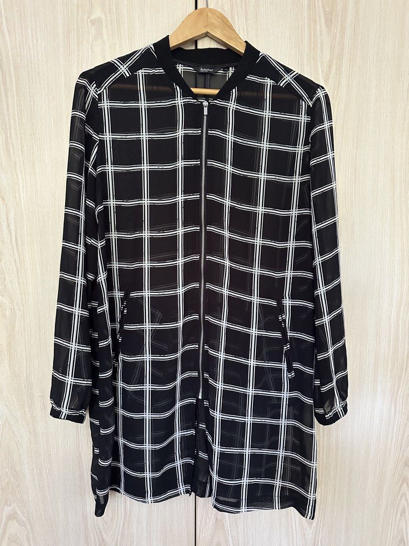 Hotwind Plaid Dress XL (Category: Dresses) located in Muntinlupa City. Submitted by belica (Listing ID 1427670841, Image 1). Description: Hey there! Check out this stylish Hotwind plaid dress in XL! It's a chic, longline jacket dress with a cool black and white plaid design. The material looks light and airy, perfect for layering. DM me if you're interested!.