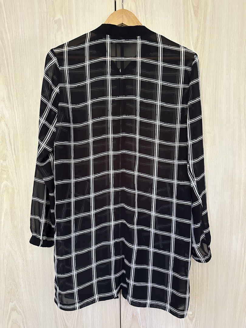 Hotwind Plaid Dress XL (Category: Dresses) located in Muntinlupa City. Submitted by belica (Listing ID 1427670841, Image 2). Description: Hey there! Check out this stylish Hotwind plaid dress in XL! It's a chic, longline jacket dress with a cool black and white plaid design. The material looks light and airy, perfect for layering. DM me if you're interested!.