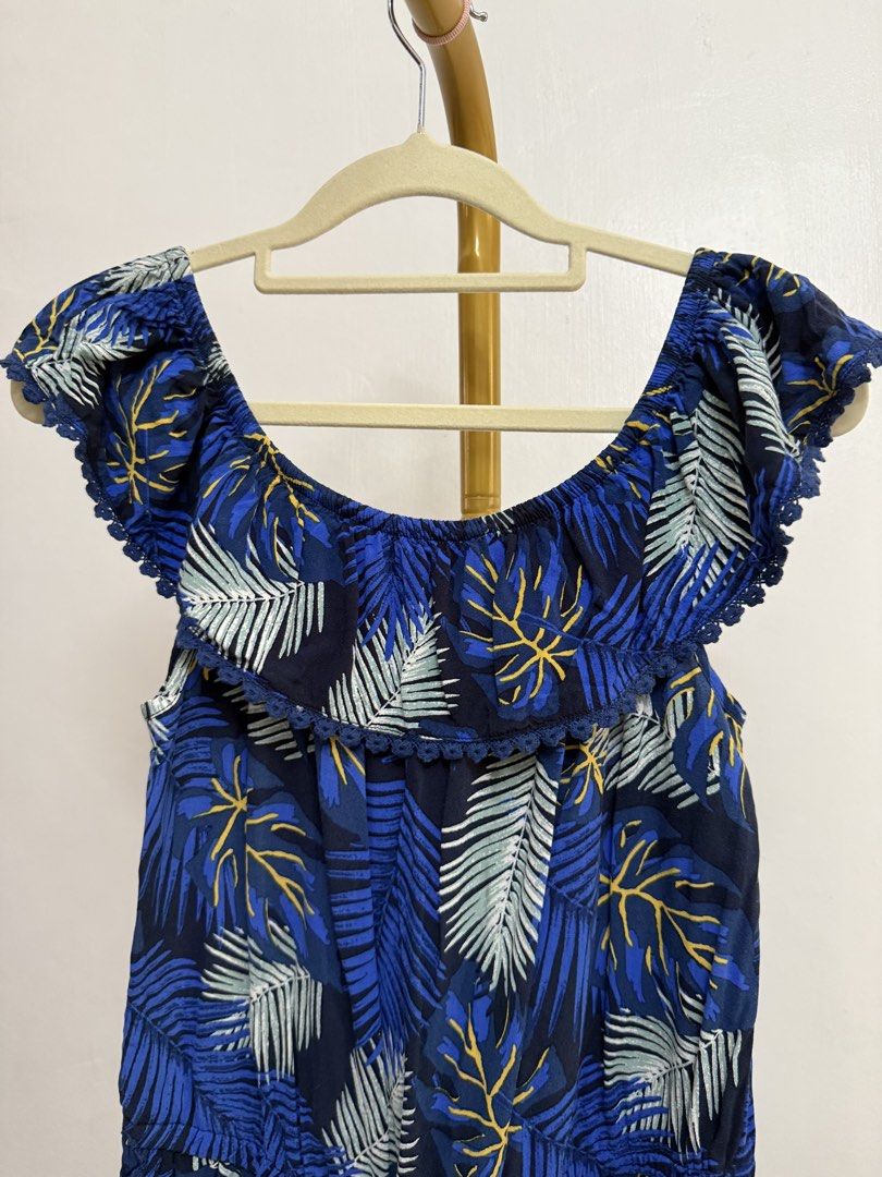 Just Jeans Blue Floral Romper Small (Category: Rompers) located in Lasam. Submitted by einalem1234 (Listing ID 1427755622, Image 2). Description: Blue floral romper from Just Jeans. Features an off-shoulder design with a drawstring waist. The romper has a vibrant blue color with a leaf pattern. Perfect for a casual and stylish look. Best fits small..