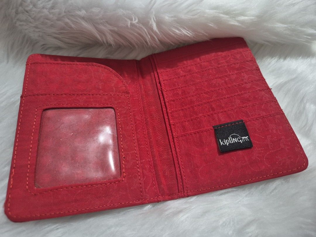 Kipling Red passport holder (Category: Wallets & Card holders) located in Quezon City. Submitted by conchicken (Listing ID 1427693813, Image 2). Description: passport holder bought in vietnam. no flaw.