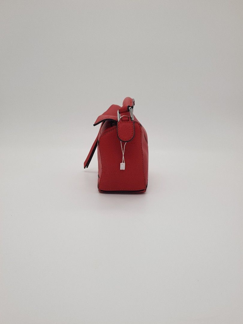 Loewe Puzzle Mini Bag Red (Category: Luxury Bags & Wallets) located in Paranaque City. Submitted by jlee_closet (Listing ID 1427667796, Image 3). Description: Guaranteed authentic and like new condition Loewe puzzle bag (sling bag, mini size). Fits an iPhone, powder, hand sanitizer, small wallet, and keys. can be used as a clutch bag, top handle bag, or a sling bag. no flaws, no issues. very pristine and mint. Php. 100k (bought this for 160k++). 
