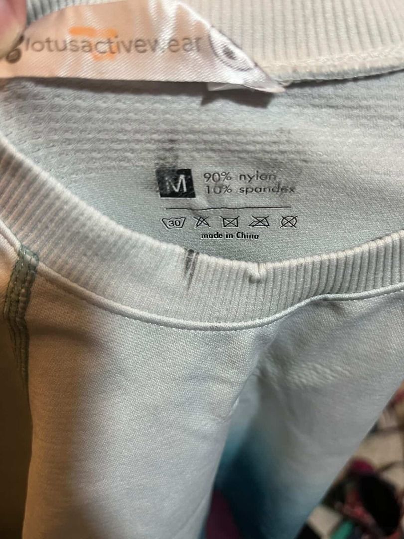 LOTUS Activewear Blue White Ombre Set - Medium (Category: Activewear) located in Mandaluyong City. Submitted by pattyph (Listing ID 1427748168, Image 2). Description: Activewear set from Lotus Activewear includes a long-sleeved crop top and matching leggings. The set features an ombre design with shades of blue and white. The top has a crew neck and thumb holes. The leggings have a high waist. Made from 90% nylon and 10% spandex. Size M. Defects: