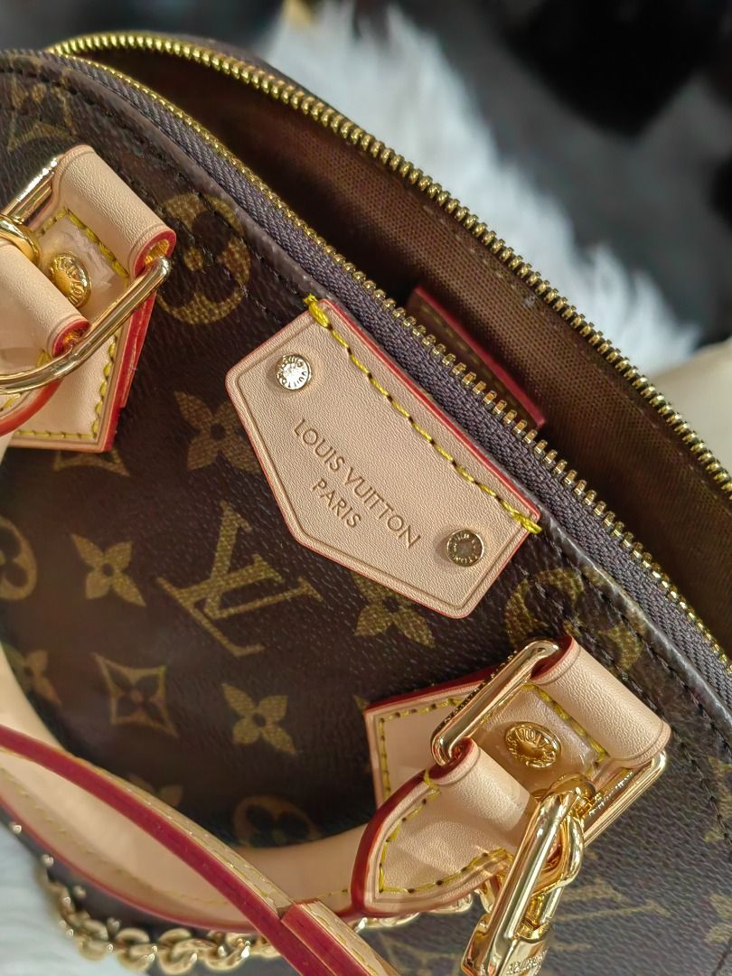 Louis Vuitton Alma BB Handbag (Category: Luxury Bags & Wallets) located in Cebu City. Submitted by erlacoleccion (Listing ID 1427642283, Image 2). Description: Louis Vuitton Alma BB handbag. Features the iconic Monogram canvas, gold-tone hardware, and a detachable shoulder strap. Includes a padlock and key set, and a dust bag. The bag has a top handle and a chain strap..