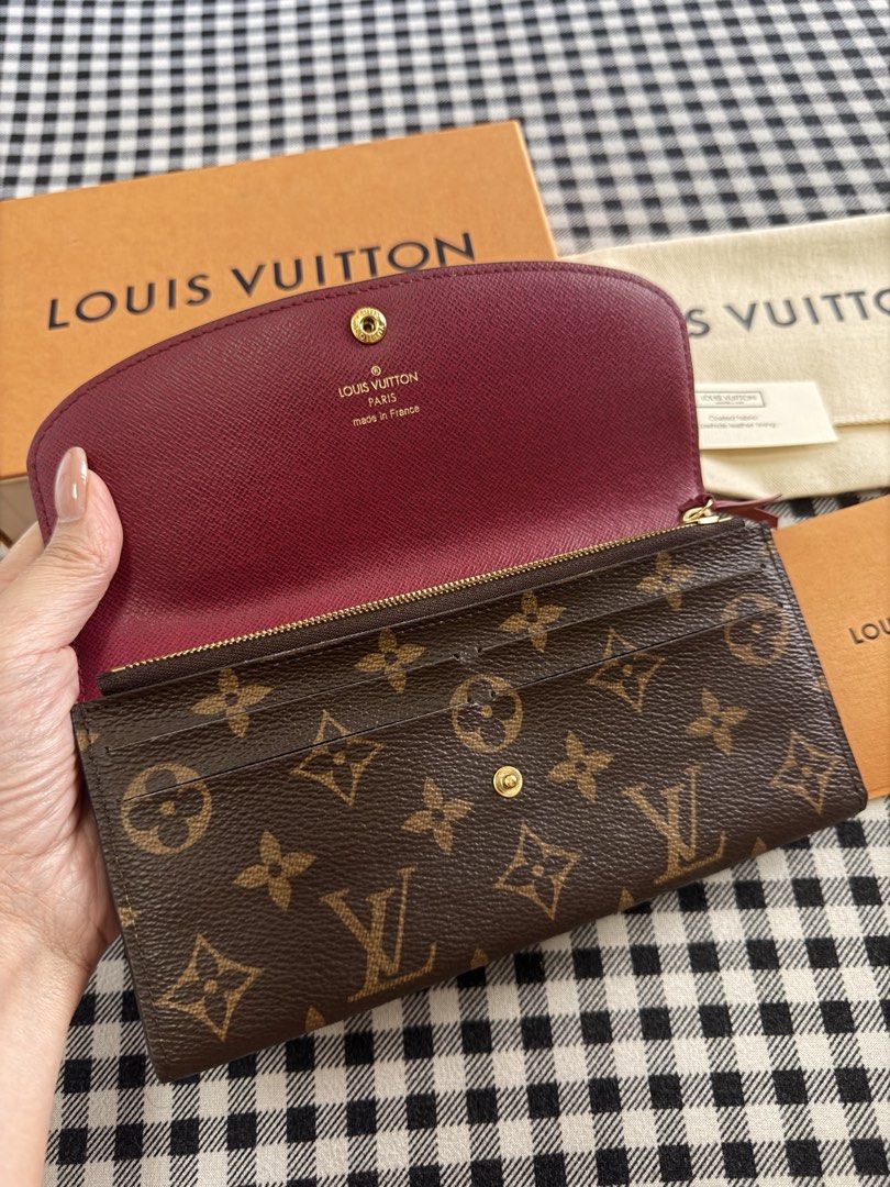 Louis Vuitton Emilie Monogram Wallet (Category: Luxury Bags & Wallets) located in Pasig City. Submitted by sugarspicesalve (Listing ID 1427668196, Image 3). Description: 👛 Louis Vuitton Emilie Wallet Monogram (Red Button) 💰 Price: ₱18,000 (negotiable for sure buyers) ✨ Selling my authentic LV Emilie Wallet in classic Monogram canvas with red interior / red snap button Slim, lightweight, and perfect for everyday use ✔️ Features: • Multiple card 