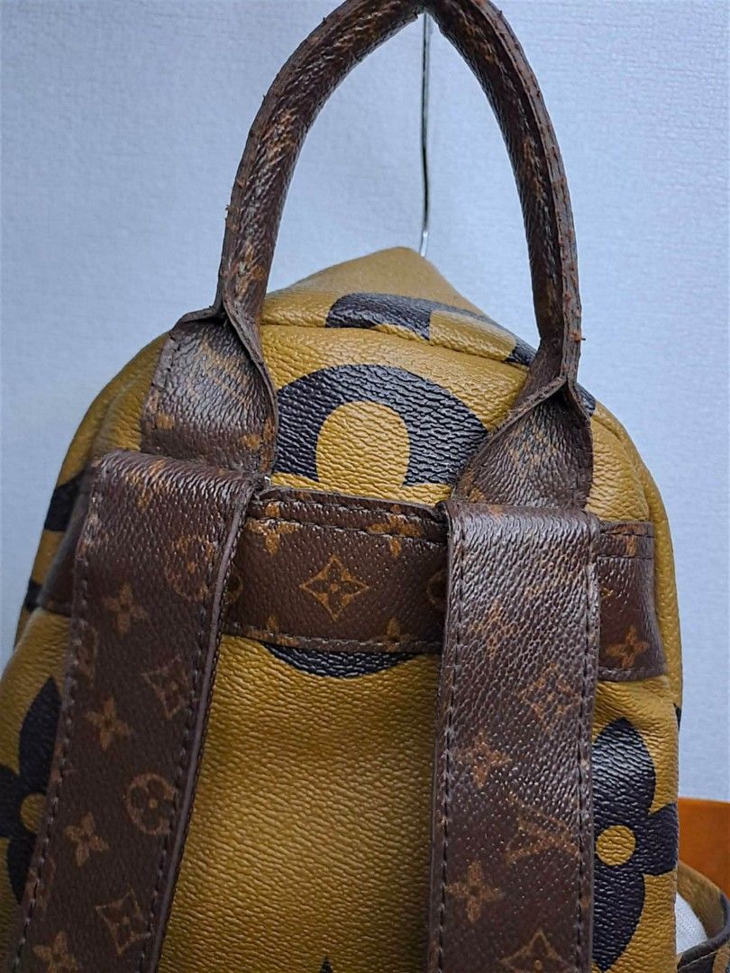 Louis Vuitton Mini Backpack (Category: Luxury Bags & Wallets) located in Quezon City. Submitted by yaseen73 (Listing ID 1427778160, Image 3). Description: •Louis Vuitton mini backpack features the iconic LV monogram pattern • It has a front pocket with a zipper and adjustable straps • The interior has a black lining with a Louis Vuitton label • The backpack has a top handle and gold-tone hardware • The zipper has the RIRI logo •The bag has some s