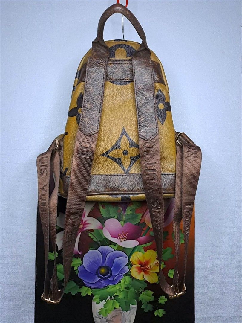 Louis Vuitton Mini Backpack (Category: Luxury Bags & Wallets) located in Quezon City. Submitted by yaseen73 (Listing ID 1427778160, Image 2). Description: •Louis Vuitton mini backpack features the iconic LV monogram pattern • It has a front pocket with a zipper and adjustable straps • The interior has a black lining with a Louis Vuitton label • The backpack has a top handle and gold-tone hardware • The zipper has the RIRI logo •The bag has some s
