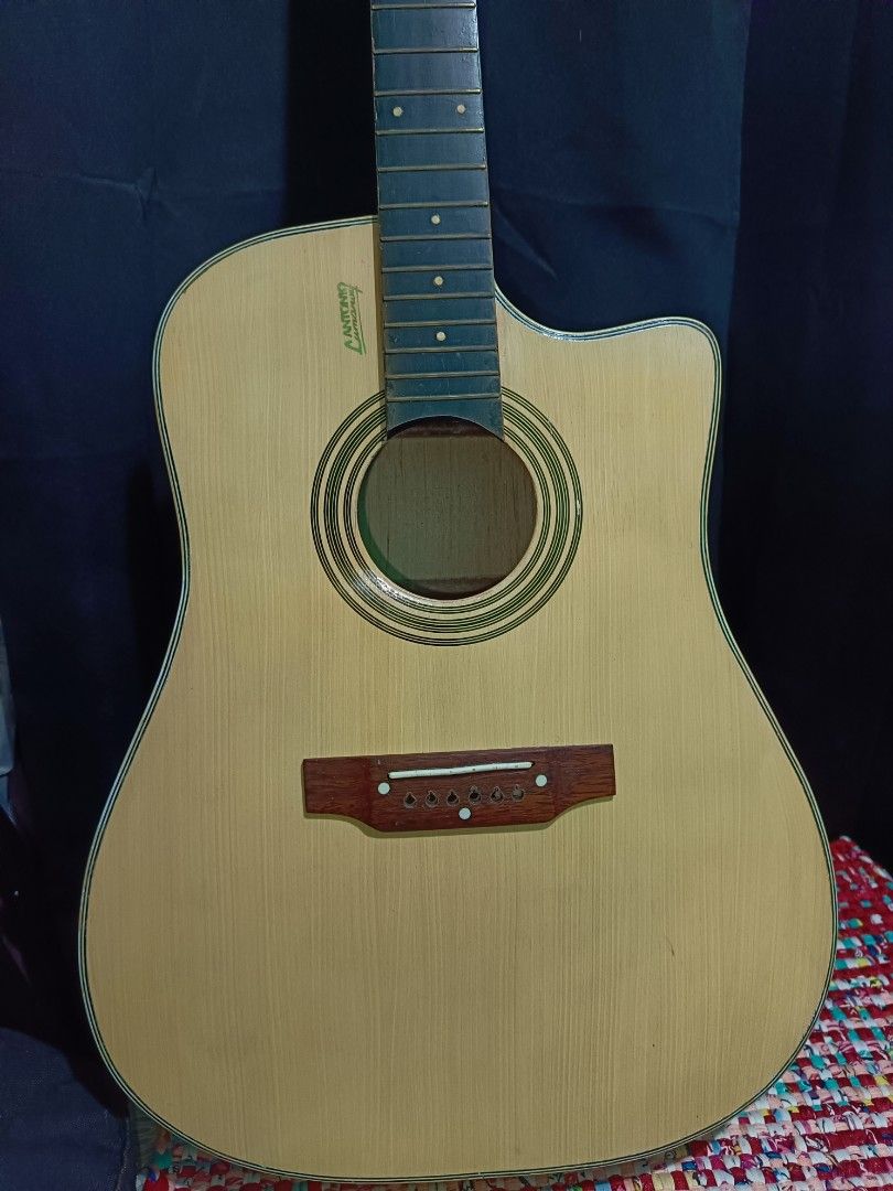 Lumanog Guitar (Category: Musical Instruments) located in Quezon City. Submitted by hiddenid42 (Listing ID 1427706528, Image 3). Description: Lumanog acoustic guitar size 42. Wala lang string super goods pa. Naka tambak na lang. Free Bag, capo and pick.
