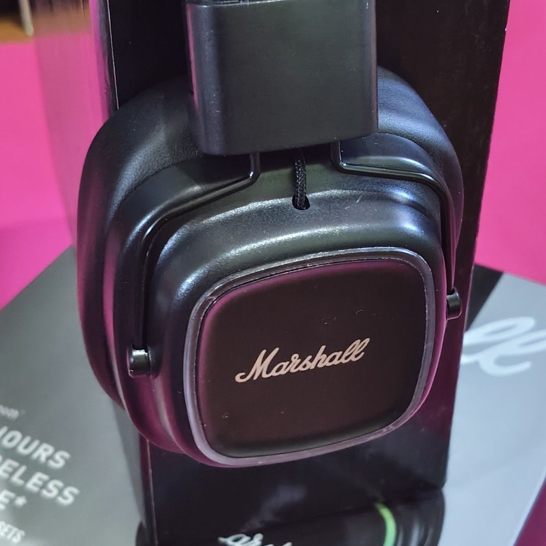 Marshall Major IV Wireless HeadphonesOEM (Category: Headphones & Headsets) located in Paranaque City. Submitted by audioaddict0517 (Listing ID 1427693034, Image 3). Description: Marshall Major IV headphones feature a black design. The box indicates 80+ hours of wireless playtime. The headphones have the Marshall logo on the earcups. The box also shows the Bluetooth feature. The headphones are over-ear style..