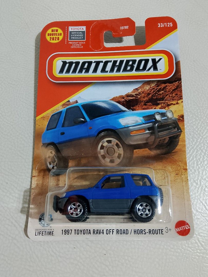 Matchbox 1997 Toyota RAV4 Off Road (Category: Vehicle & Diecast Models) located in Paranaque City. Submitted by g-books-n-toys (Listing ID 1427770817, Image 1). Description: Matchbox 1997 Toyota RAV4 Off Road diecast car. Features a blue and gray color scheme. The packaging indicates it's part of the 2020 New Models series, number 33/125. Includes the Toyota official licensed product logo. Suitable for ages 3+. Made by Mattel..