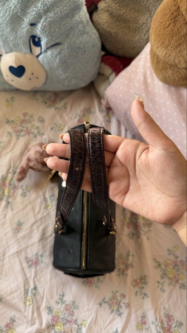 MCM Black Cylinder papillon Handbag (Category: Luxury Bags & Wallets) located in Tagaytay City. Submitted by ashhh_leyyyy (Listing ID 1427707802, Image 3). Description: - slightly nego -turnable screw -MCM Black Cylinder Papillon Handbag - Classic black shoulder bag - Features the iconic MCM logo - Unique cylinder/papillon shape.