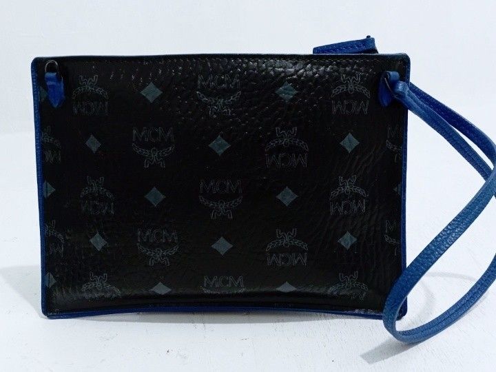 MCM TASCHE POCHETTE ,kili bag ( only ) (Category: Luxury Bags & Wallets) located in Manila. Submitted by eriiicaspage (Listing ID 1427746243, Image 3). Description: PREOWNED LIGHTLY USED MCM Tasche Pochette LEATHER WRISLET /KILI BAG (Only ) SMALL BLACK & BLUE COLORBLOCK LEATHER BRASS hardware YKK Zip wth Small Etiketa intact inside Good Condition 9/10.